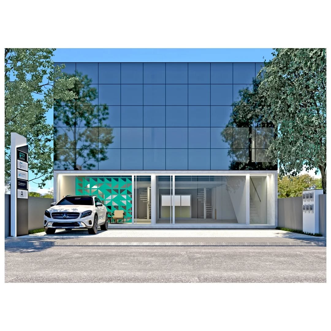 Edifício comercial com fachada envidraçada e árvores